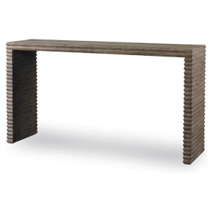 The Belmont Console in Rustic Grey Pine sits in a studio.