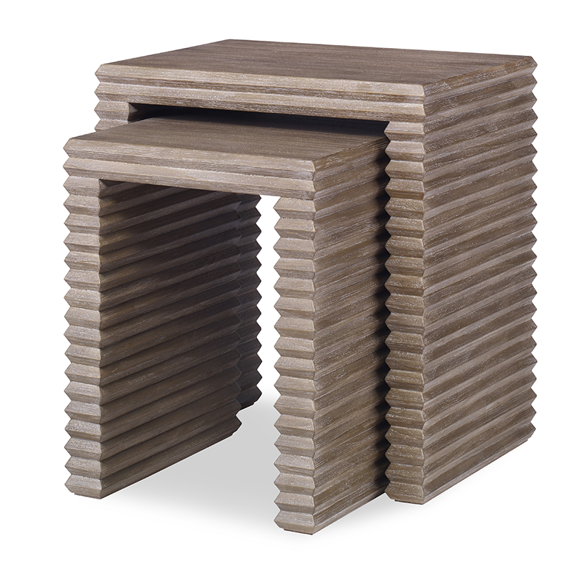 The Belmont Nesting Table in Rustic Grey Pine sits in a studio.