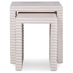 The Belmont Nesting Table in White Rustic Pine sits in a studio.