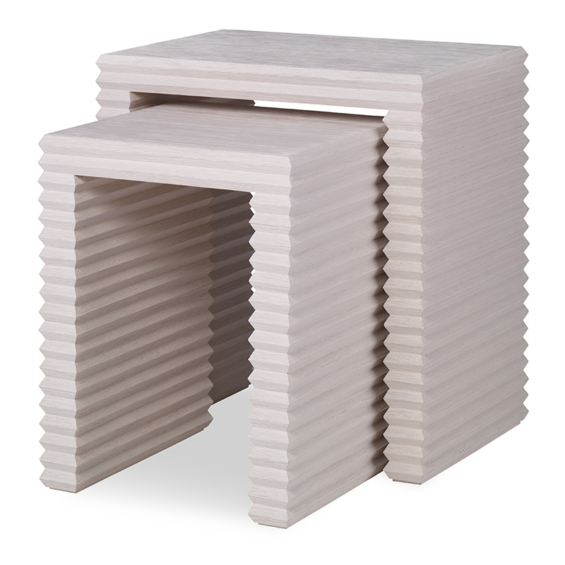 The Belmont Nesting Table in White Rustic Pine sits in a studio.