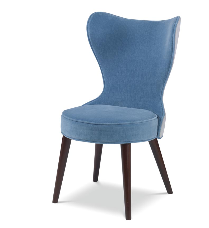 The Maribella Chair in Celbes Velvet with Cannon Grey Velvet back sits in a studio.
