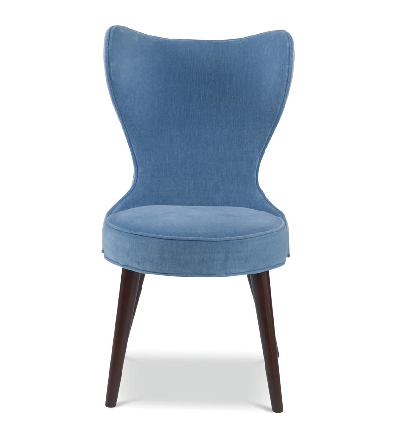 The Maribella Chair in Celbes Velvet with Cannon Grey Velvet back sits in a studio.