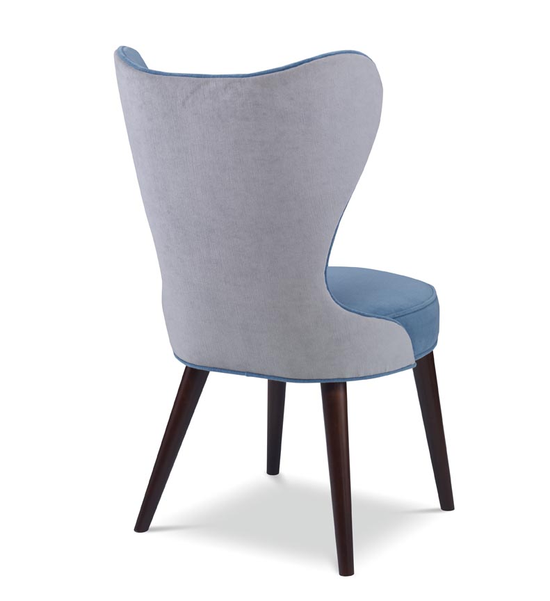 The Maribella Chair in Celbes Velvet with Cannon Grey Velvet back sits in a studio.