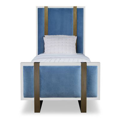 The Mercer Bed, Twin in White Smooth Gesso and Harbour Velvet sits in a studio.