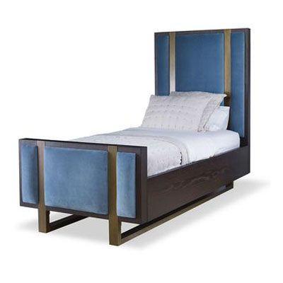 The Mercer Bed, Twin in Warm Dark Oak and Harbour Velvet sits in a studio.
