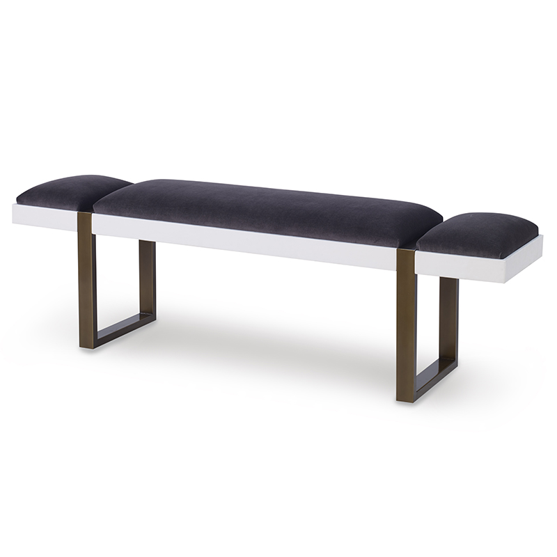 The Mercer Bench in Anchovy Velvet and White Gesso sits in a studio.