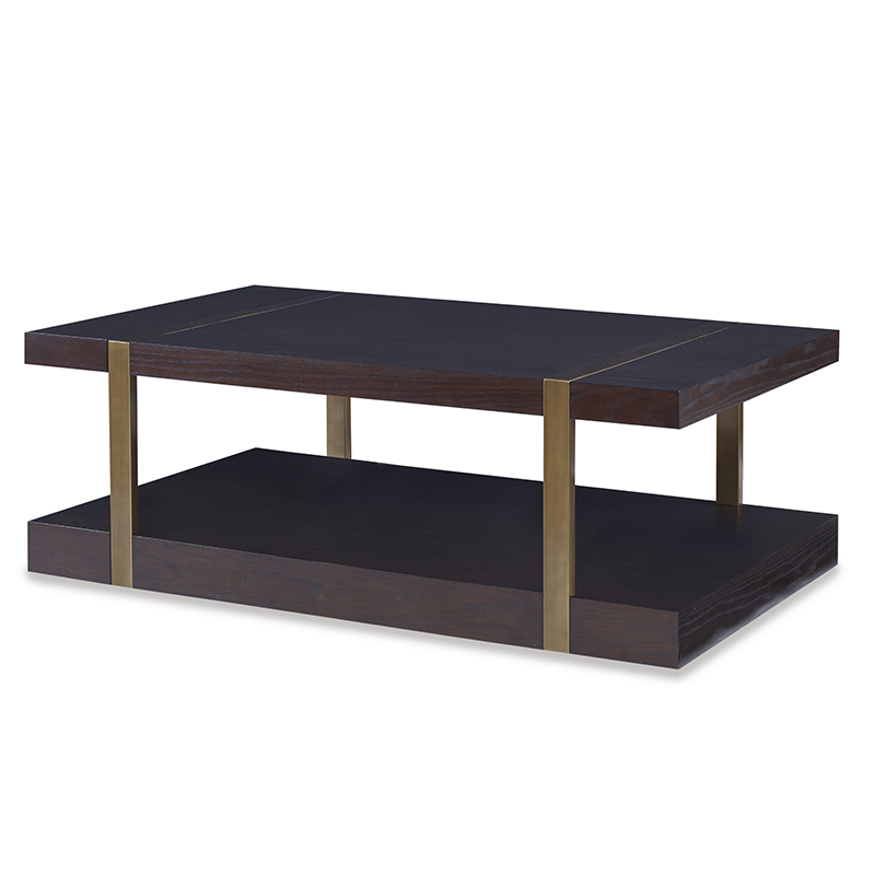 The Mercer Coffee Table in Warm Dark Oak with Finished Aged Brass sits in a studio.