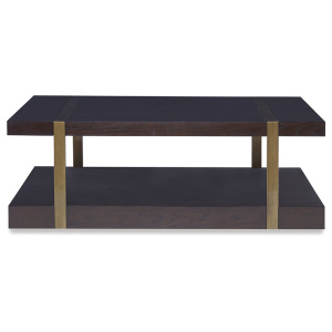 The Mercer Coffee Table in Warm Dark Oak with Finished Aged Brass sits in a studio.