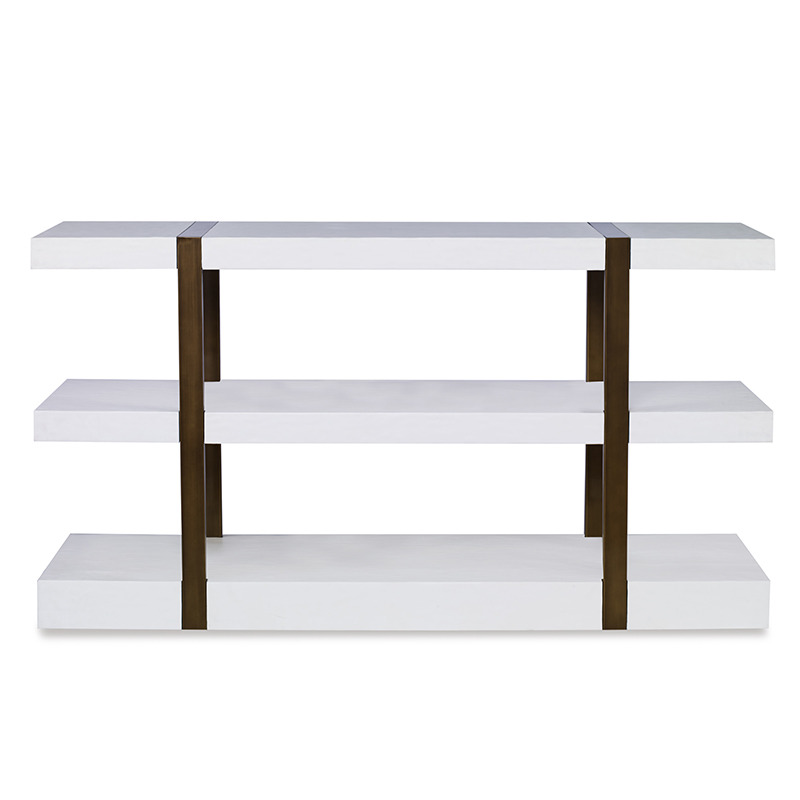 The Mercer Console in Smooth White Gesso with Finished Aged Brass sits in a studio.