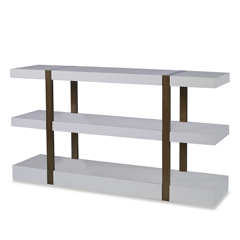 The Mercer Console in Smooth White Gesso with Finished Aged Brass sits in a studio.